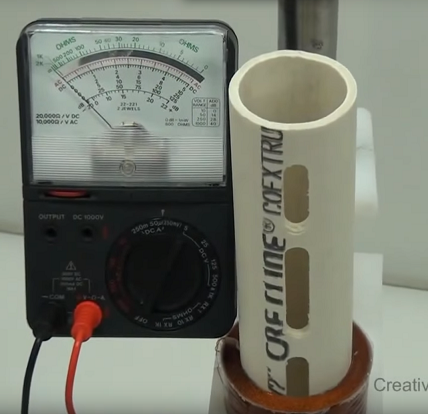 Photo of volt meter and PVC pipe with air coil