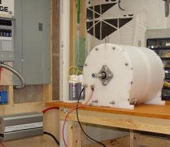 Photo of our Fuel-less Engine SP500 Generator charging a 12 volt DC battery bank with a 5kw inverter connected