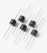 Photo of five rectifier diodes, color black on white