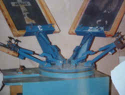 Photo of our JCM1 5 color screen printing machine, in blue